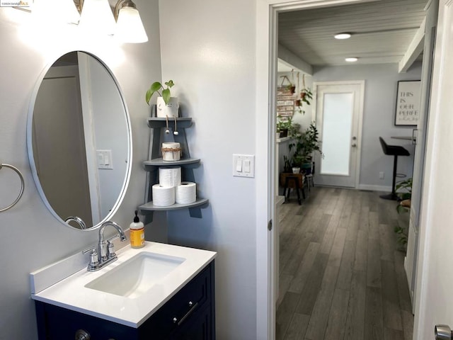 bathroom featuring vanity and hardwood / wood-style flooring