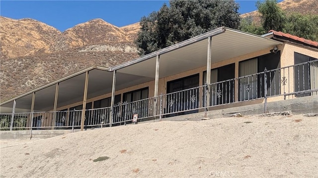 rear view of house with a mountain view