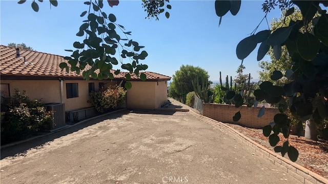 view of property exterior featuring central AC