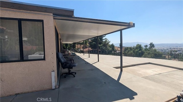 view of patio / terrace with a mountain view