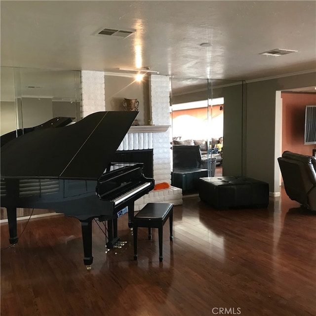 misc room featuring hardwood / wood-style flooring and ornamental molding