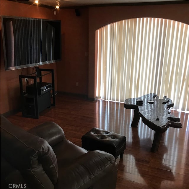 living room with dark hardwood / wood-style floors