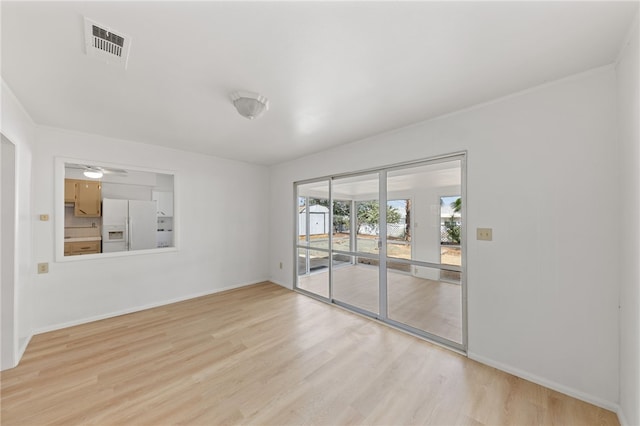 empty room with light hardwood / wood-style floors