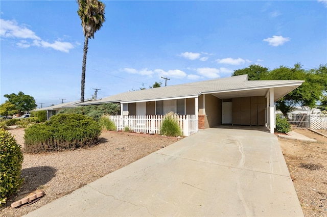 ranch-style home with a carport