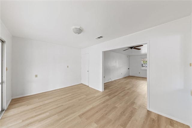 empty room with light hardwood / wood-style floors and ceiling fan