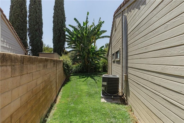 view of yard with central air condition unit