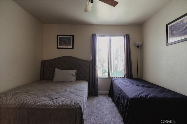 bedroom with light colored carpet and ceiling fan