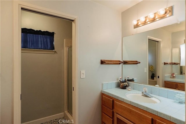 bathroom featuring vanity and walk in shower