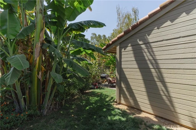 view of home's exterior with a yard