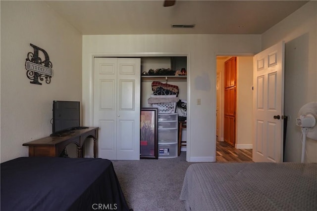 carpeted bedroom with a closet