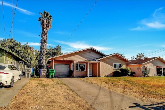 ranch-style home featuring a garage and a front lawn