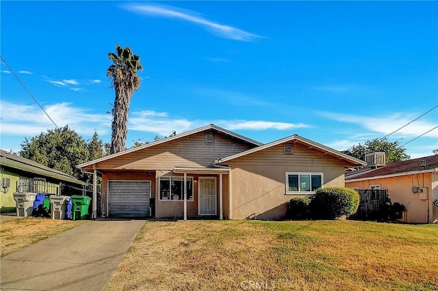 ranch-style house featuring a garage and a front lawn