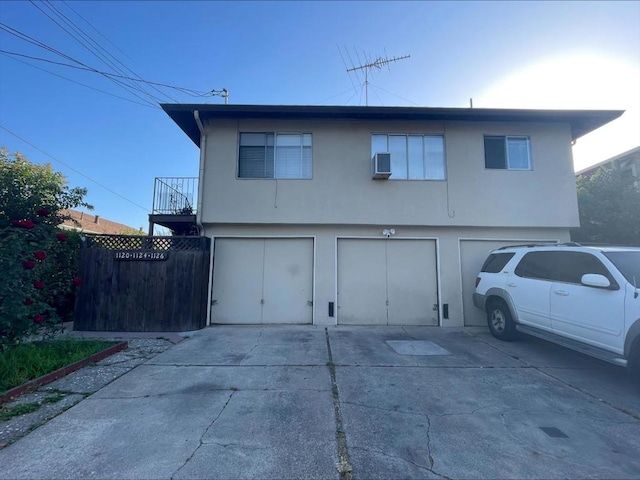 back of house with a garage