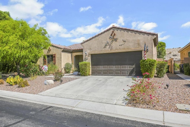 mediterranean / spanish-style house with a garage