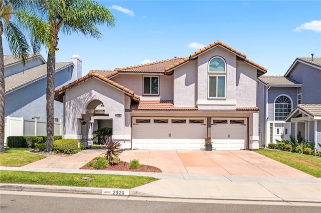 mediterranean / spanish-style house featuring a garage