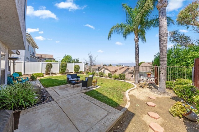 view of yard featuring a patio area and outdoor lounge area