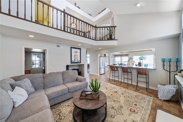 living room featuring a high ceiling