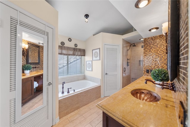 bathroom with plus walk in shower and vanity