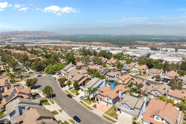 drone / aerial view featuring a mountain view