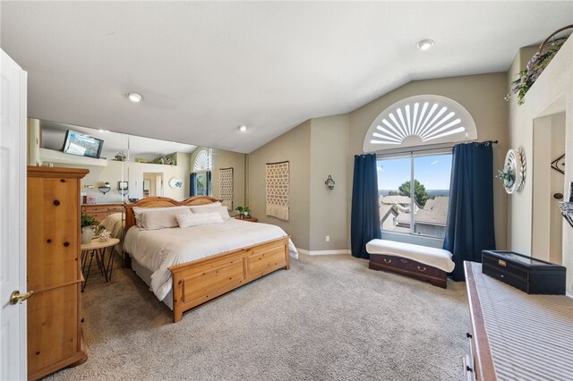 bedroom with carpet and vaulted ceiling