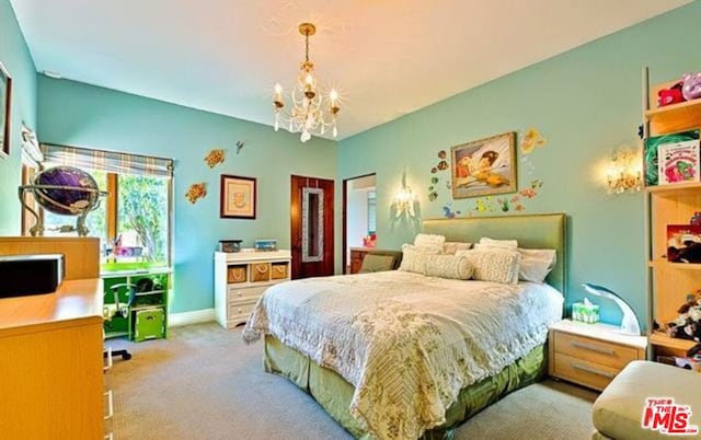 carpeted bedroom featuring an inviting chandelier