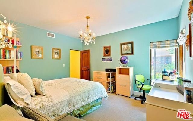 bedroom with light colored carpet and a notable chandelier