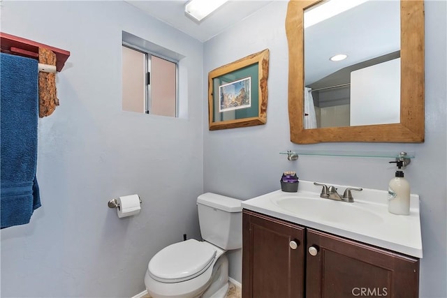 bathroom with toilet and vanity