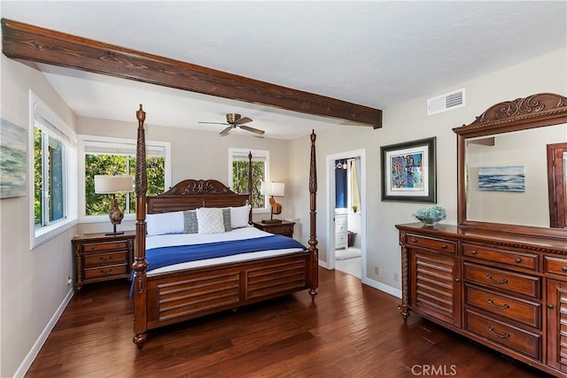 bedroom with ensuite bath, ceiling fan, dark hardwood / wood-style flooring, and beamed ceiling