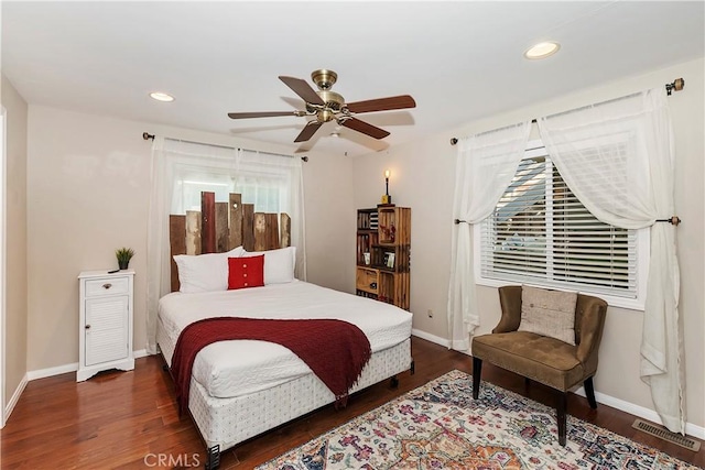 bedroom featuring ceiling fan and dark hardwood / wood-style flooring