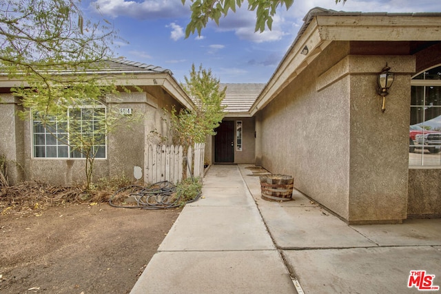 entrance to property with a patio area