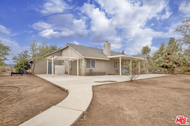 rear view of property with a patio