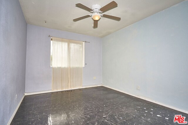 spare room with ceiling fan