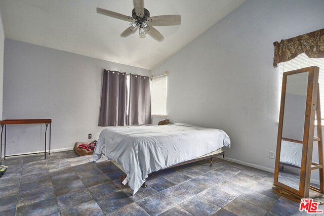 bedroom featuring lofted ceiling and ceiling fan