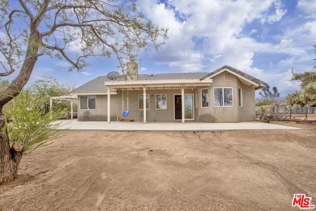 rear view of property with a patio