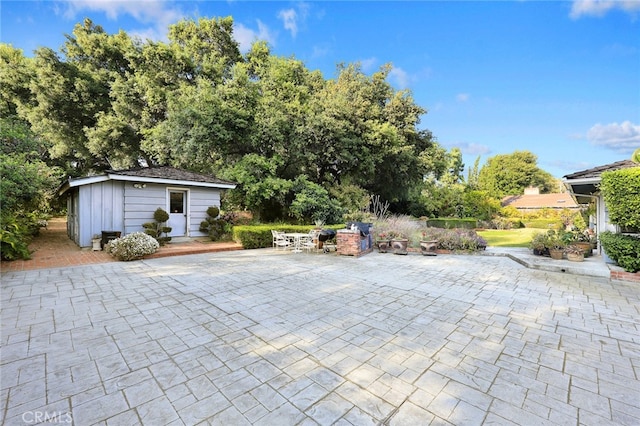 view of patio featuring a storage shed