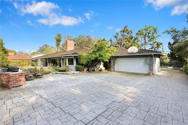 ranch-style house featuring a garage