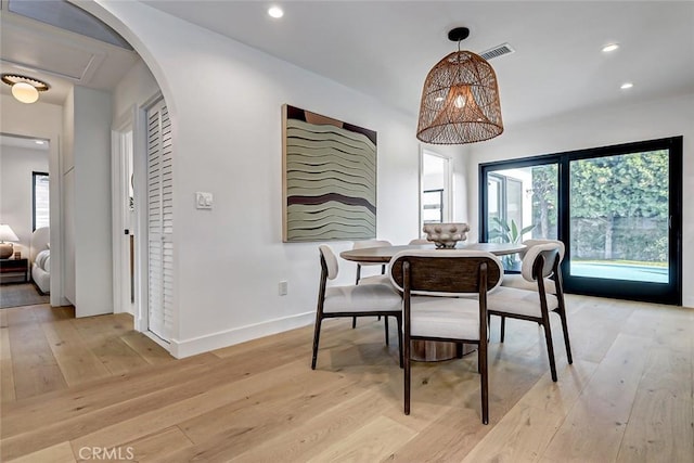 dining area featuring light wood-type flooring