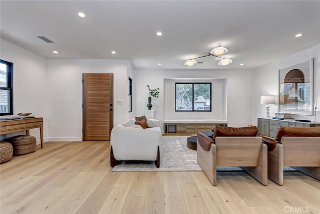 living room with light hardwood / wood-style flooring