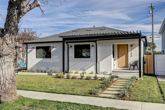 bungalow-style house with a front yard