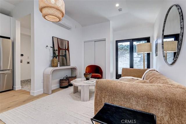 interior space with light hardwood / wood-style floors and an AC wall unit