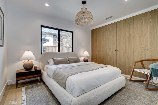 bedroom featuring wood-type flooring