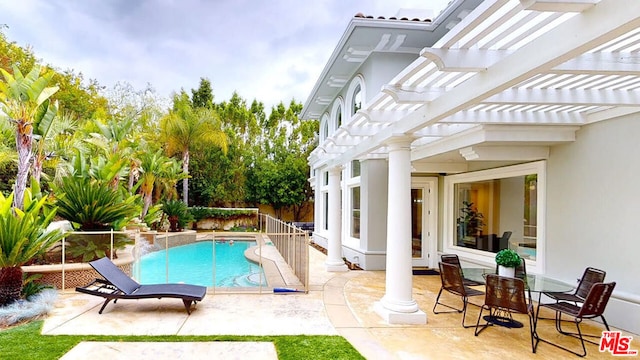 view of swimming pool with a pergola and a patio area