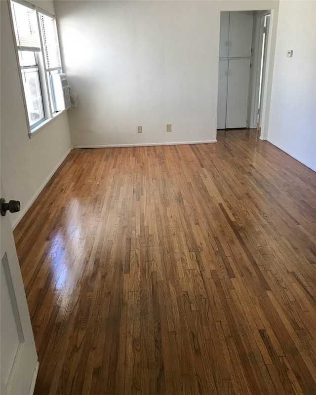 unfurnished room featuring wood-type flooring