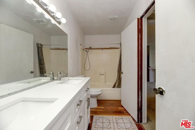 full bathroom featuring toilet, vanity, shower / bath combination with curtain, and hardwood / wood-style flooring