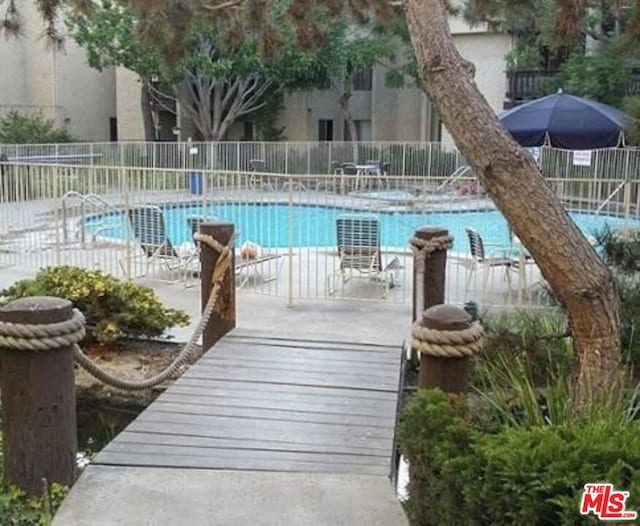 view of swimming pool with a patio