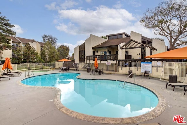 view of swimming pool featuring a patio