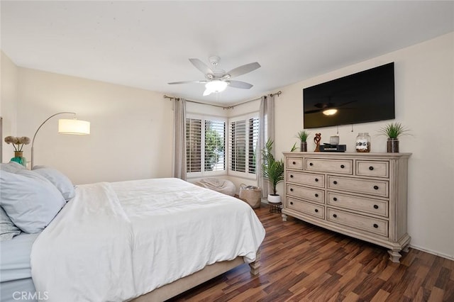 bedroom with ceiling fan and dark wood-type flooring