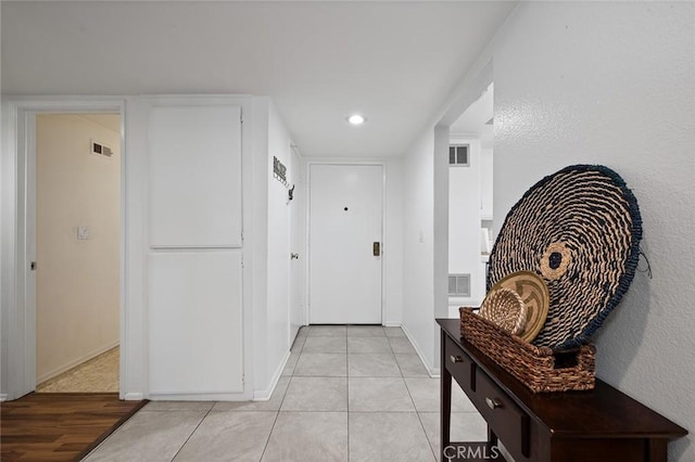 corridor featuring light hardwood / wood-style floors