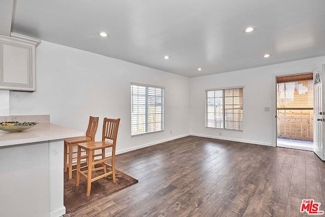 dining space featuring dark hardwood / wood-style floors