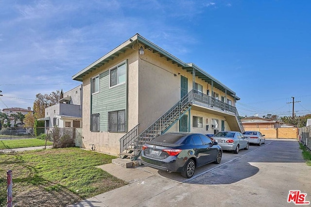 view of property exterior with a lawn